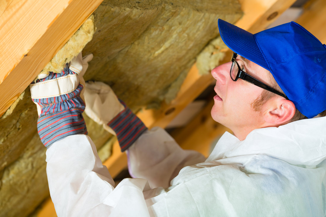 worker detaching the insulation