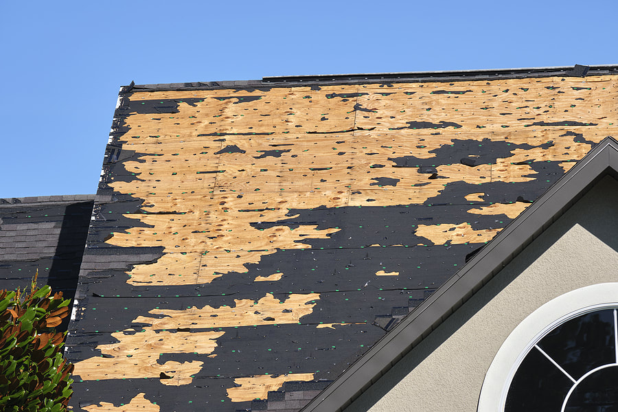damaged roof of the house