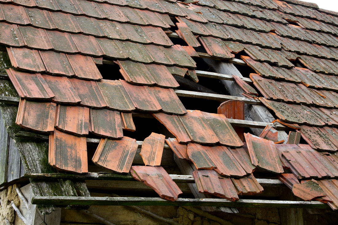 old house with damaged roof